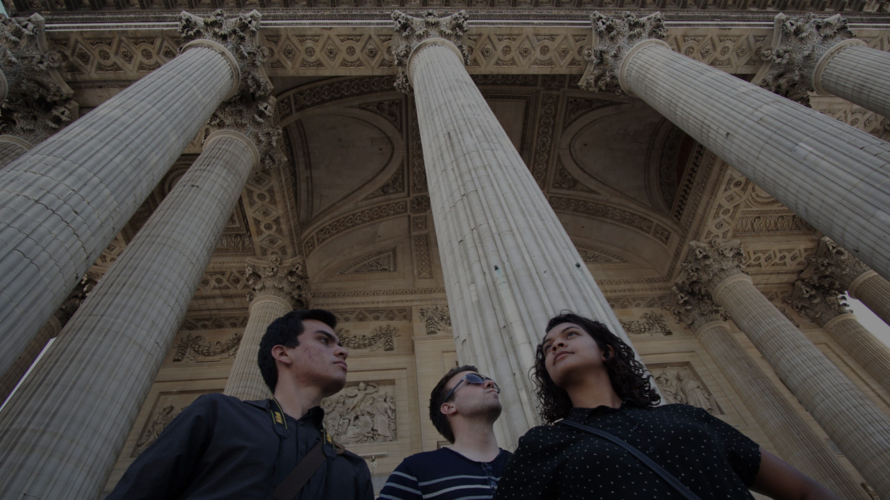 Students examining the architecture of a building