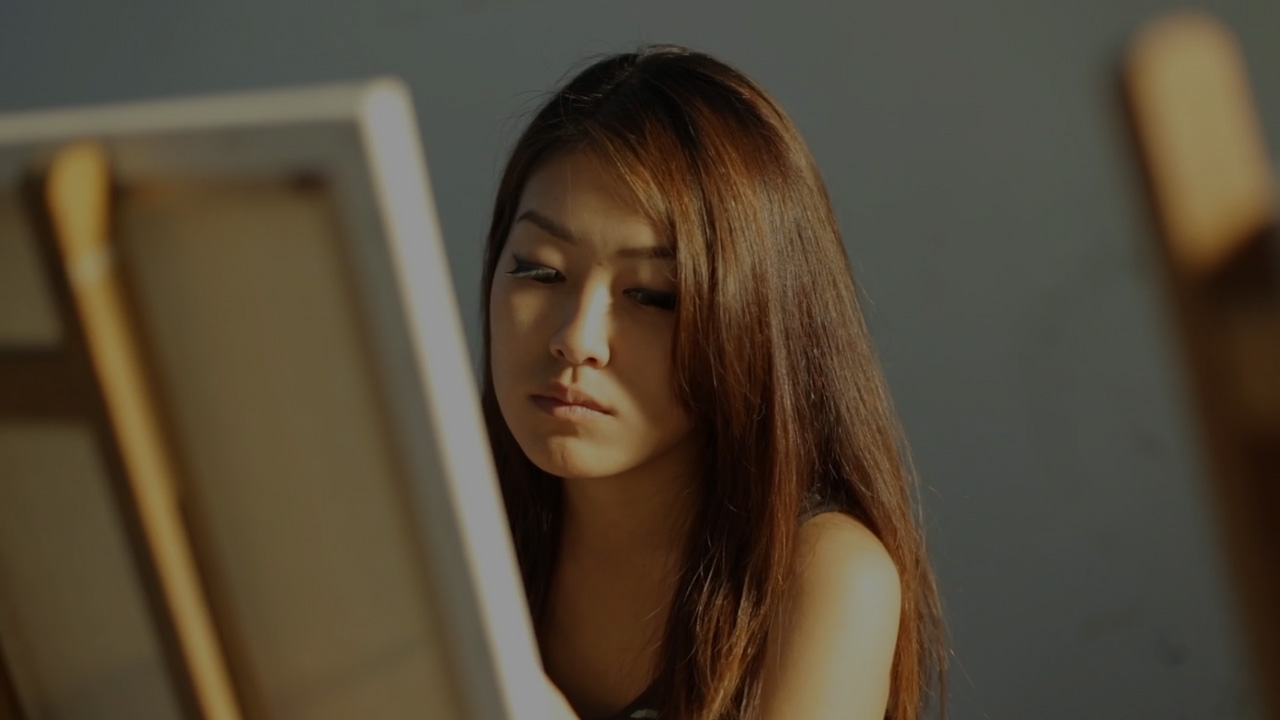 Student painting on a canvas