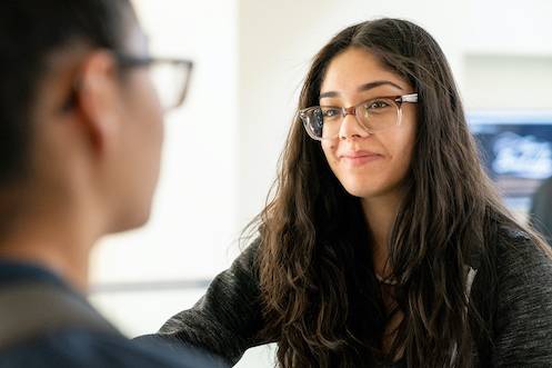 Two CBU students having a conversation