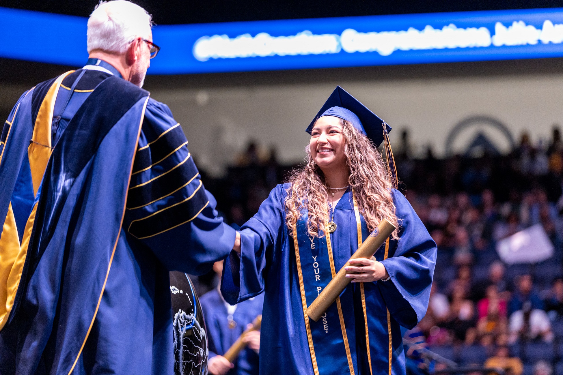 CBU Graduate on stage