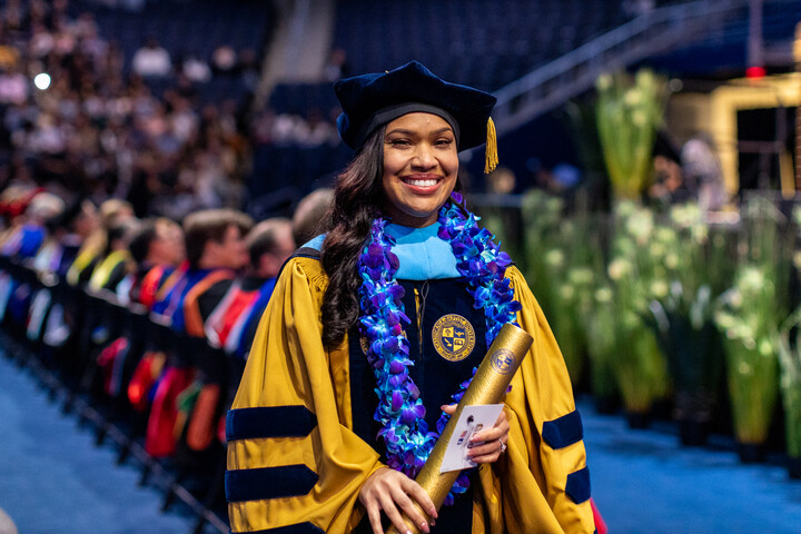 grad posing for camera