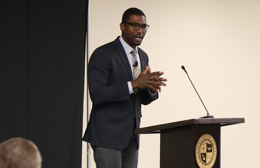 professor walter strickland at the podium