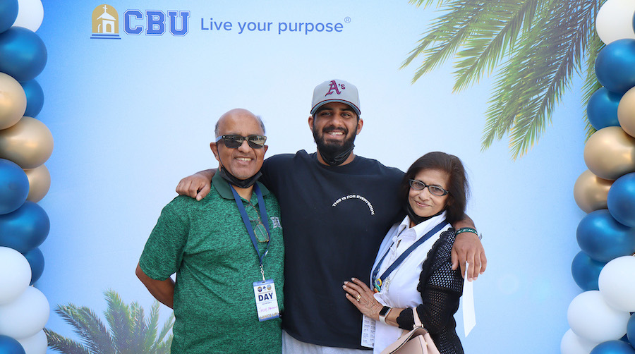 grandparents posing with student