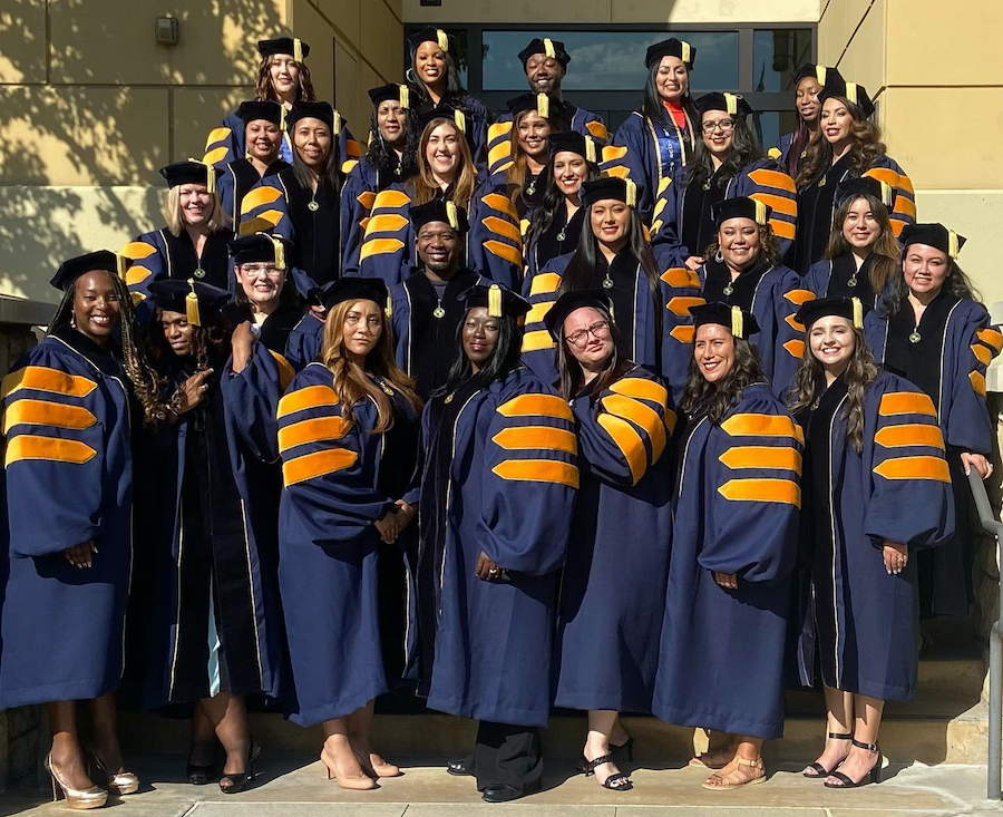 group of dsw graduates wearing gowns 