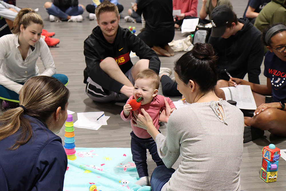 As babies kicked their legs, grabbed toys and sat up, students from California Baptist University observed the infantile, yet appropriate, movement.