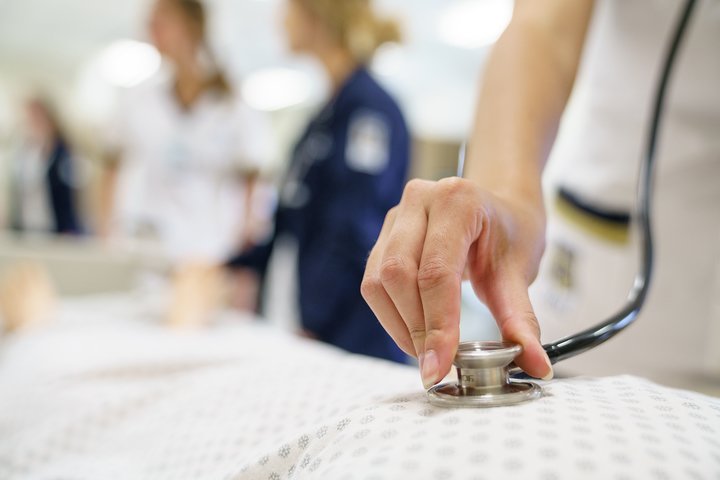 Nurse using stethoscope
