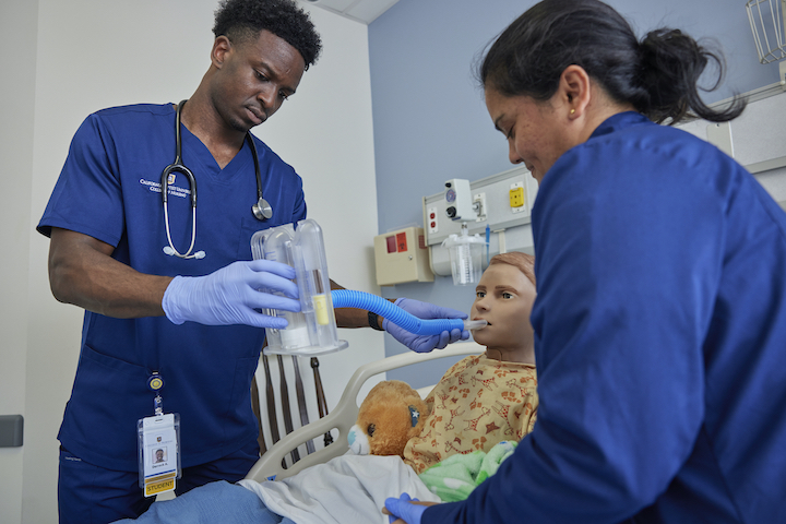 2 CBU students working in simulation