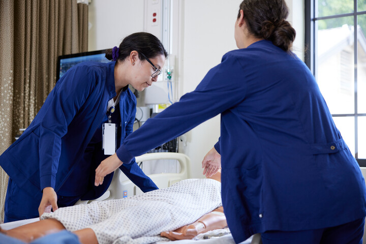 Nursing students working in simulation