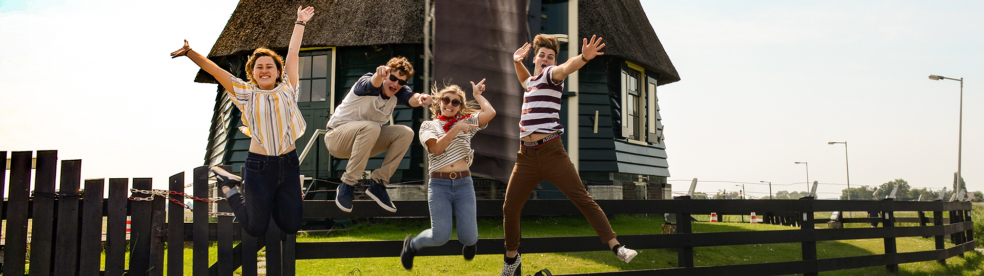 students in front of windmill