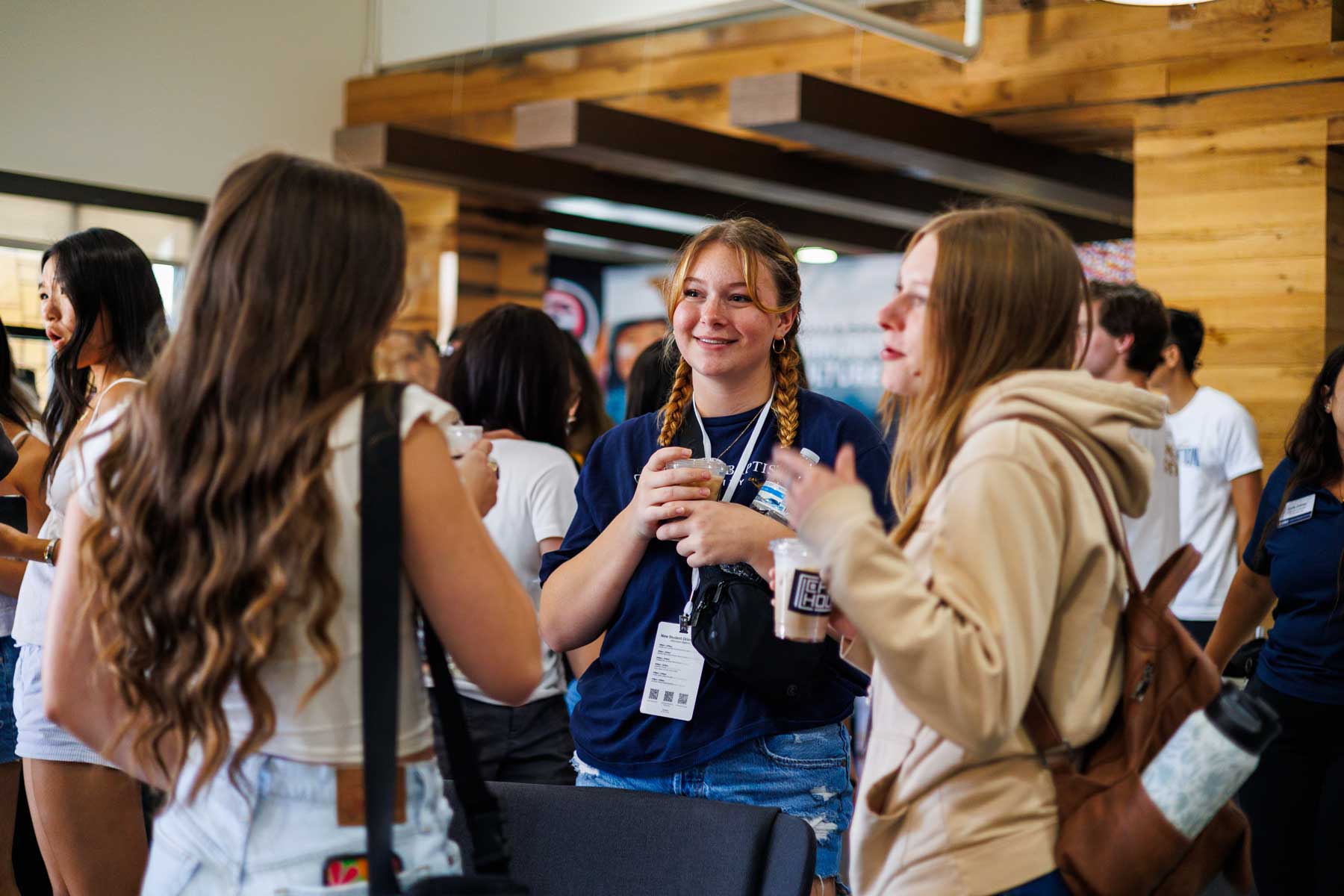 Students having a conversation with coffee