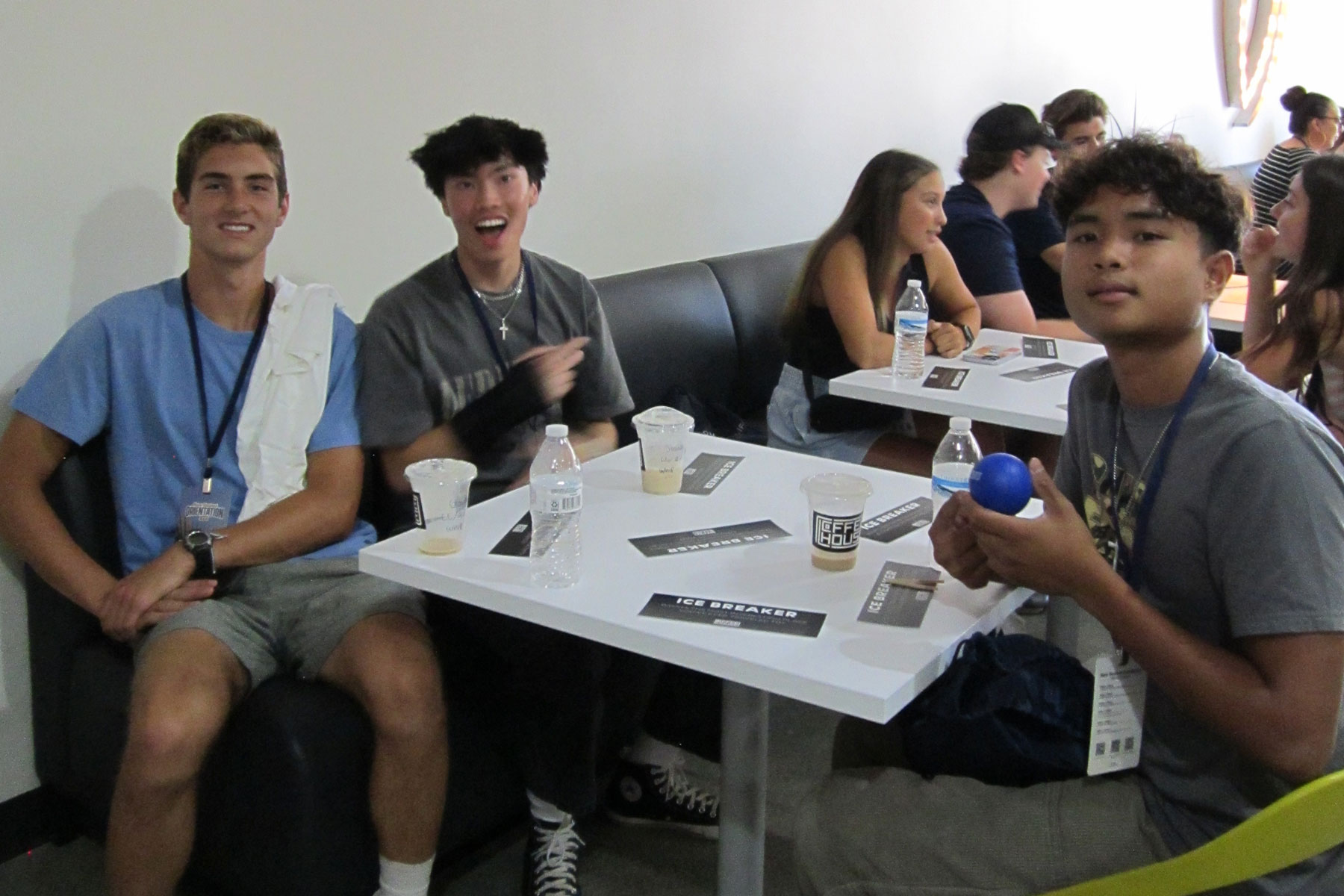 3 students sitting at a table