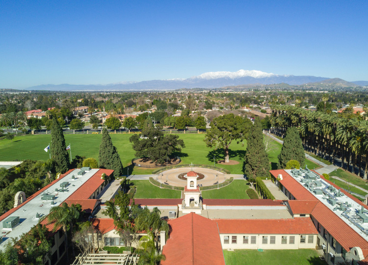 student posing with the Lance Up sign